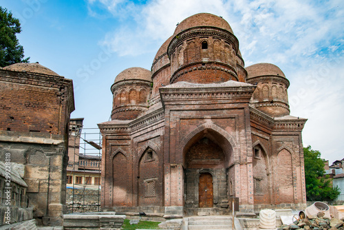 Graves surround the Tomb of Budshah, a popular tourist attraction in Srinagar, Kashmir, India.