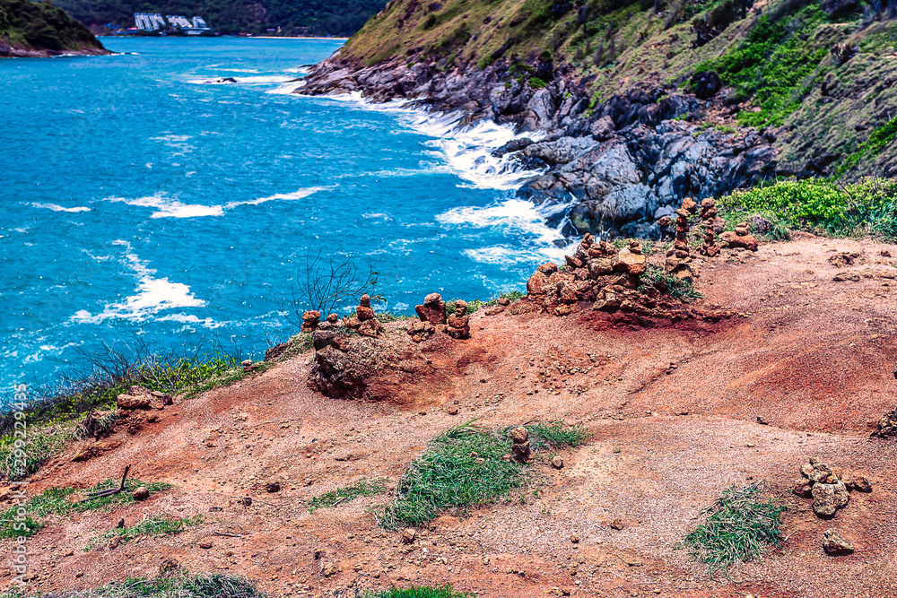 Looking off a cliffs edge at Promthep Cape