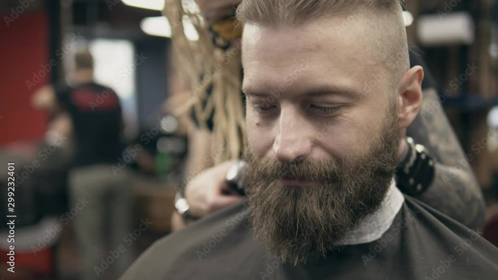 Young handsome bearded man at barbershop Young handsome bearded man at barbershop