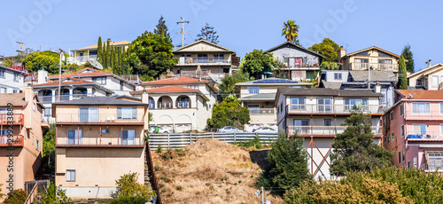Residential neighborhood with multilevel single family homes, built on a hill in San Leandro, Alameda County, East San Francisco Bay Area