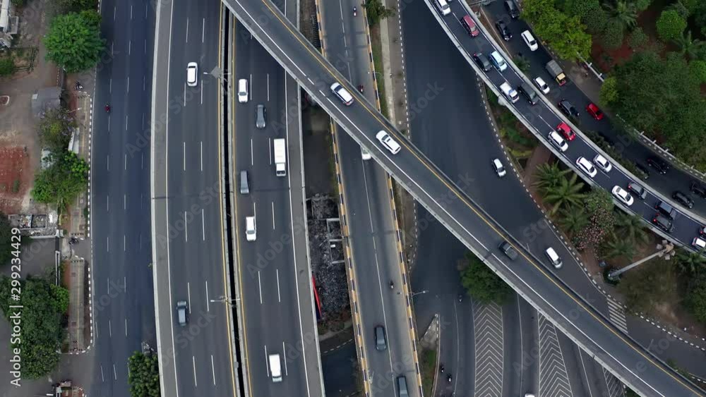 Aerial view above Jakarta city traffic congestion lanes on busy highway. Indonesia. Aerial view above Jakarta city traffic congestion lanes on busy highway. Indonesia.