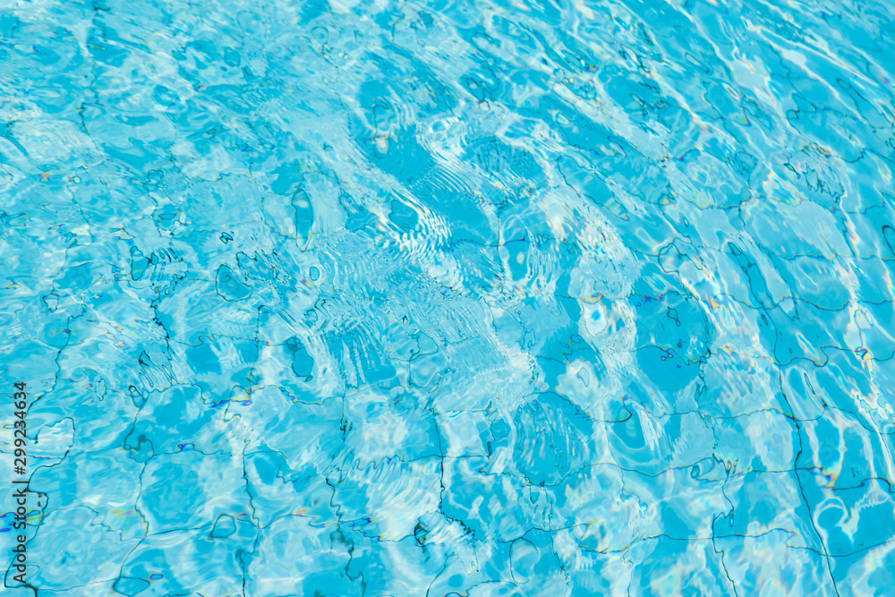 Water surface in blue swimming pool