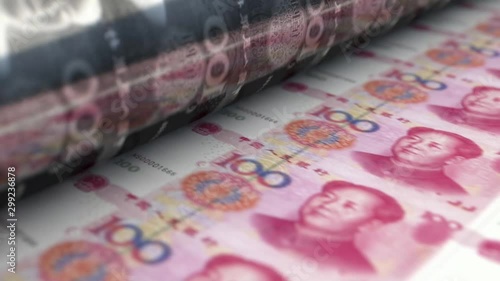 A loop able animation concept image showing a long sheet of Chinese yuan renminbi notes going through a print roller in its final phase of a print run photo