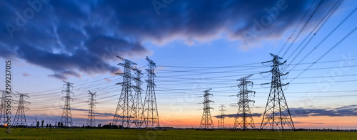 High voltage electricity tower sky sunset landscape,industrial background. photo