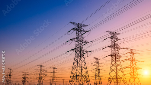 Fotografering High voltage electricity tower sky sunset landscape,industrial background