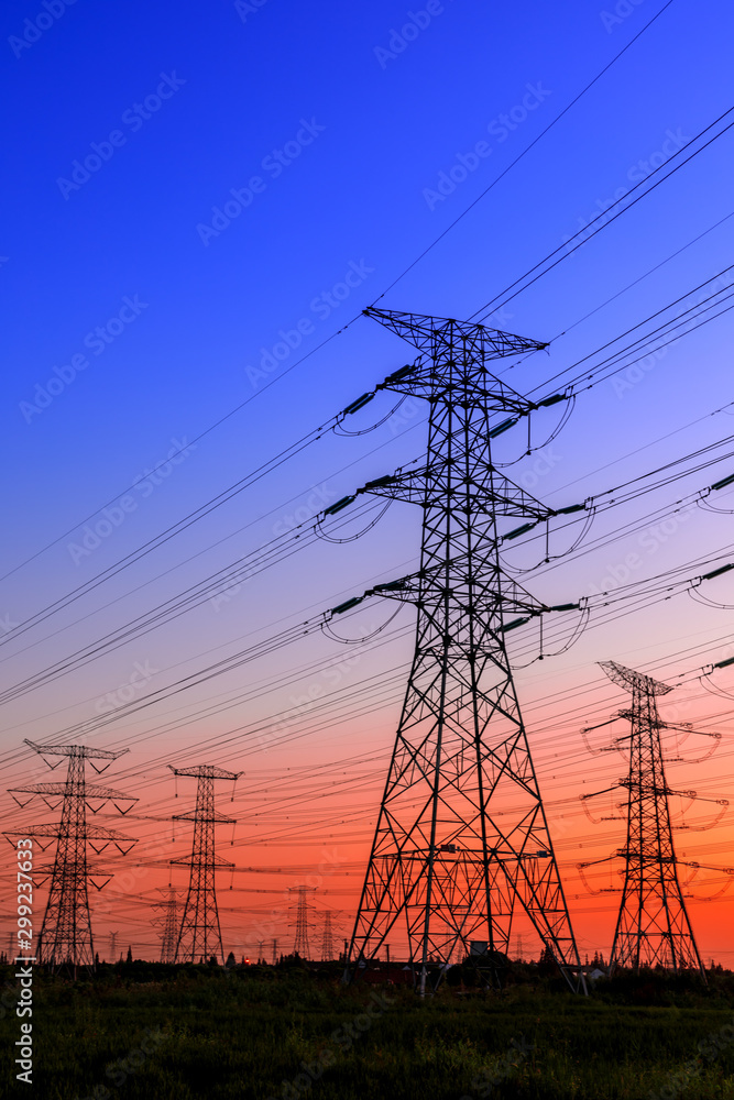 Fototapeta premium High voltage electricity tower sky sunset landscape,industrial background.