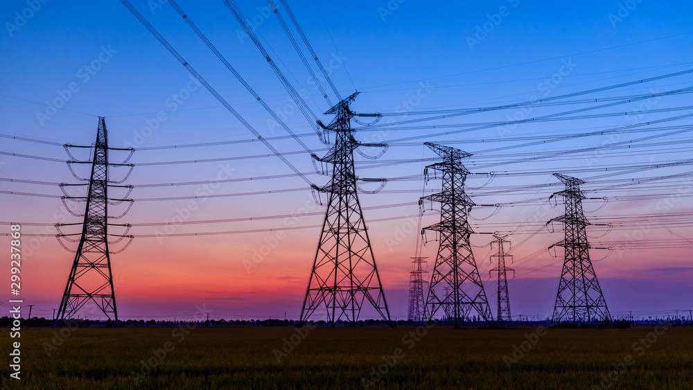 Fototapeta premium High voltage electricity tower sky sunset landscape,industrial background.