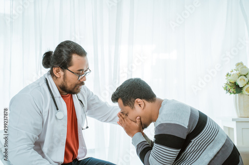 sad patient consultation with doctor try to comfort him of the bad news