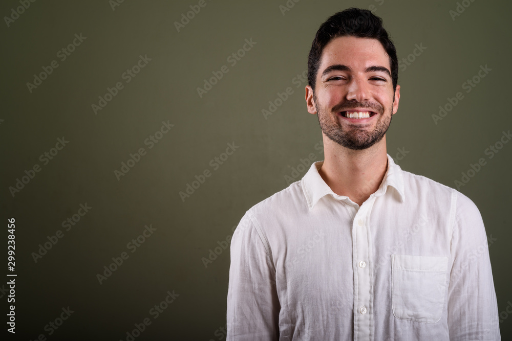 Fototapeta premium Portrait of young handsome businessman with stubble beard