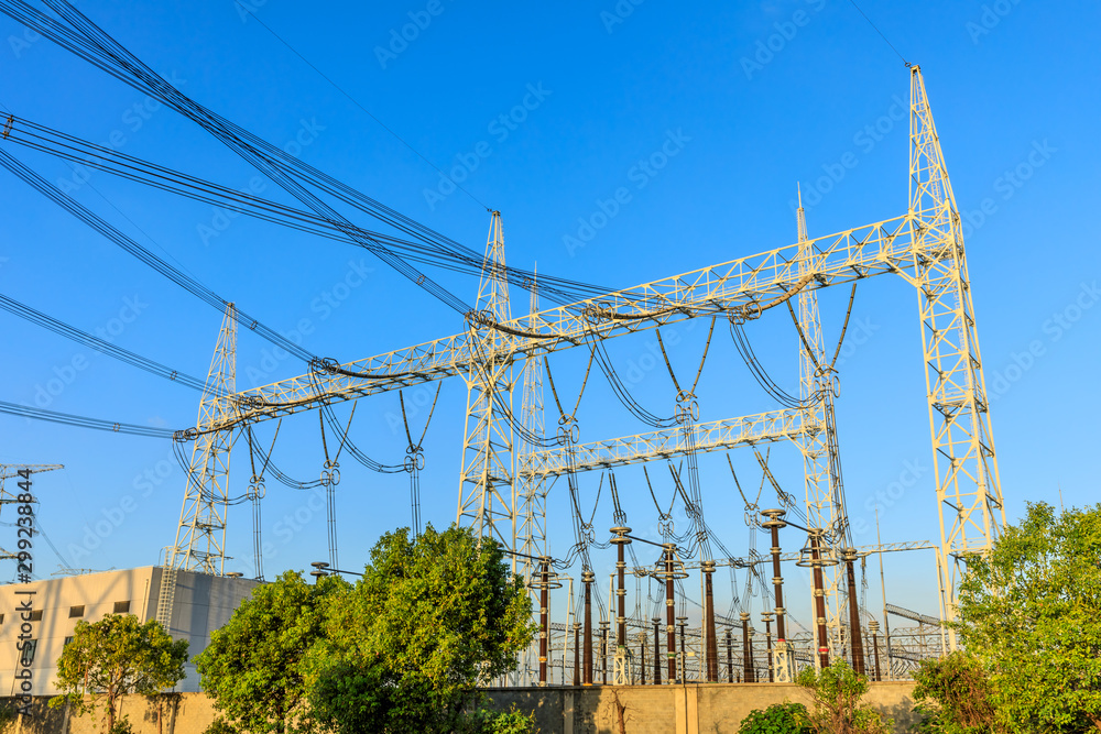 Fototapeta premium High voltage electricity tower at sunset.substation industrial background.