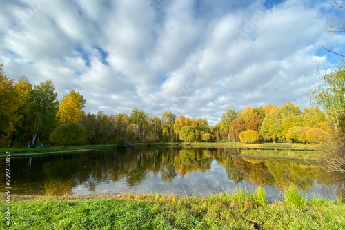 Autumn landscape. View of the lake autumn forest, beautiful sky