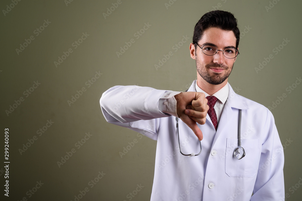 Portrait of young handsome man doctor with eyeglasses Portrait of young handsome man doctor with eyeglasses