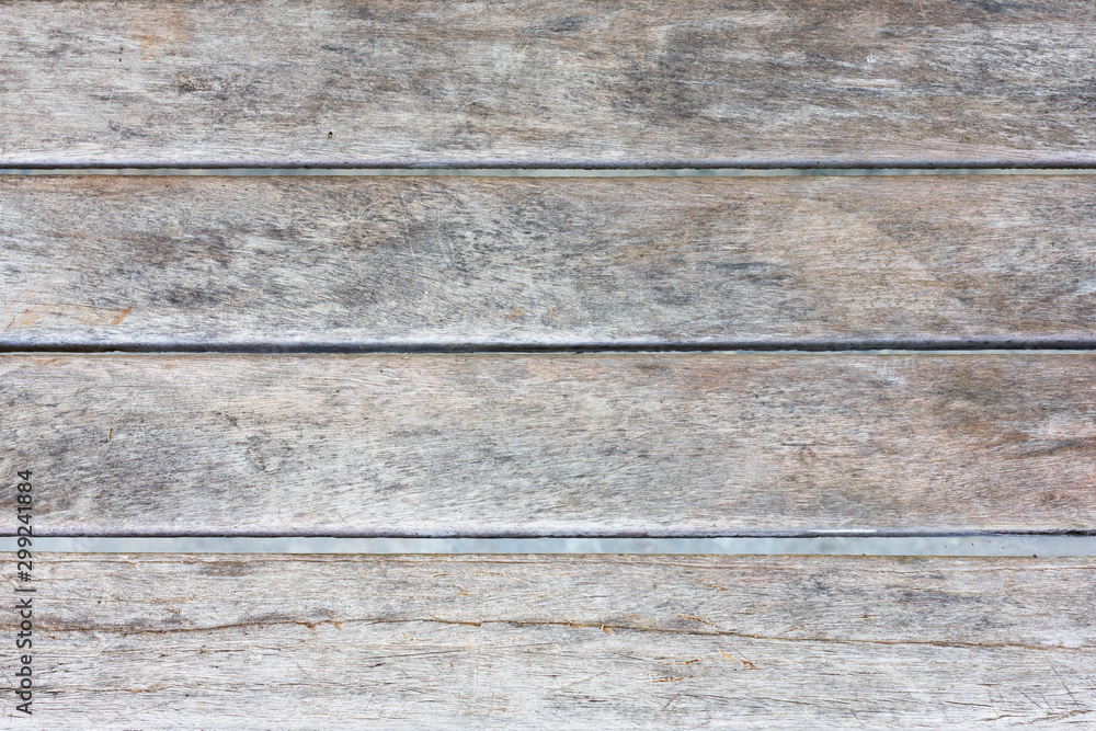 Obraz premium Vintage weathered shabby wood texture as background. Old wooden background. Wooden table or floor.
