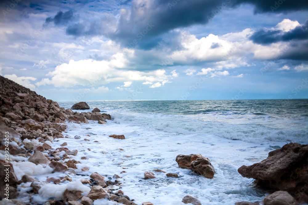 Ocean against the background of the cloudy sky.