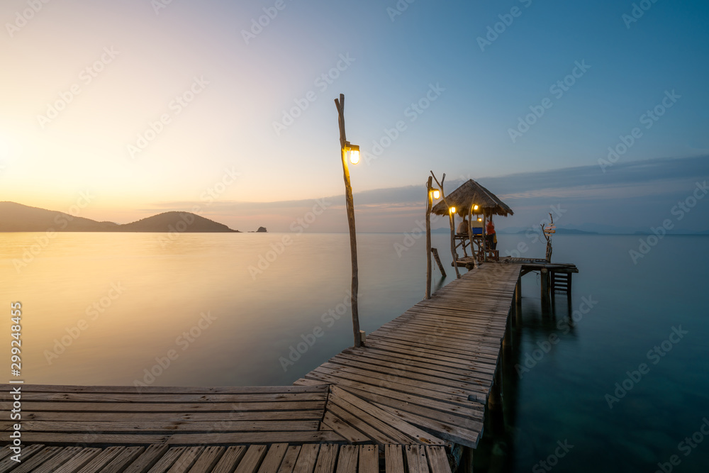 Wooden bar in sea and hut with clear sunrise sky in Koh Mak at Trat, Thailand. Summer, Travel, Vacation and Holiday. Relax and traveling at sea concept.
