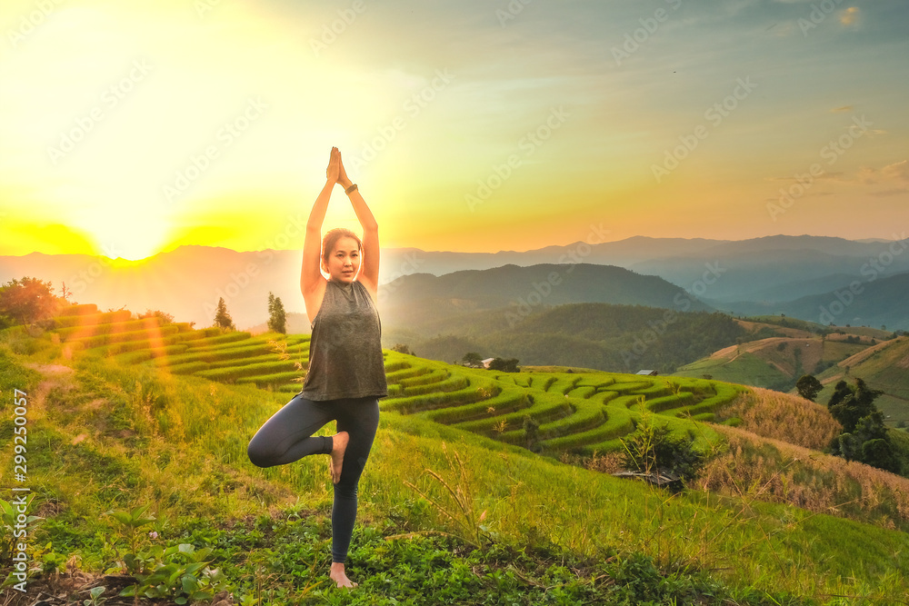 Healthy woman lifestyle balanced practicing meditate and zen energy yoga outdoors on the bridge in morning the mountain nature. Healthy life Concept. - obrazy, fototapety, plakaty 