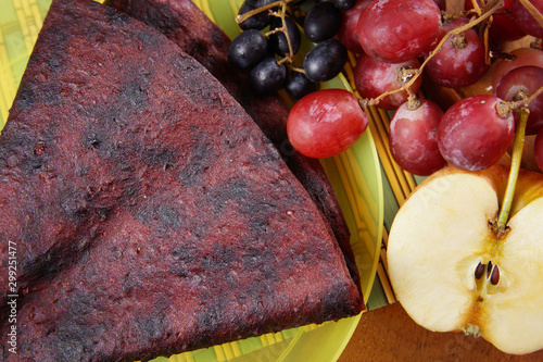 Tasty fruit pastille made of grape and apples. Healthy dietetic food photo