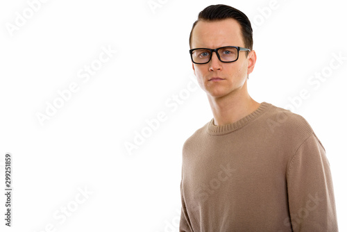 Portrait of young handsome man wearing eyeglasses © Ranta Images