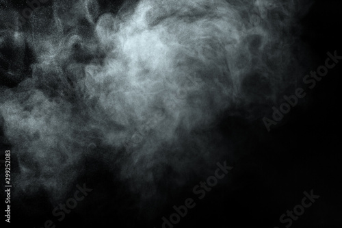 Abstract  powder or smoke isolated on black background