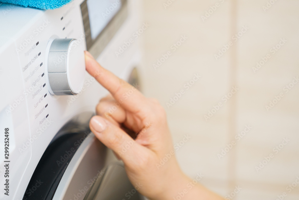 Person setting washing machine