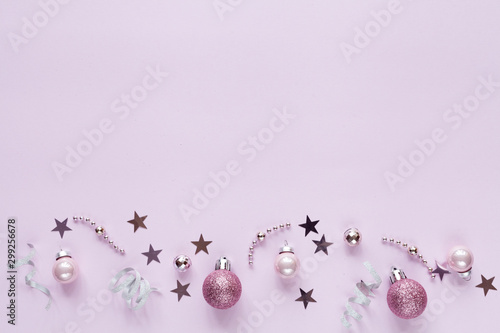 Pink christmas background with christmas balls and other decoration and accessories. Flat lay. Christmas mock-up