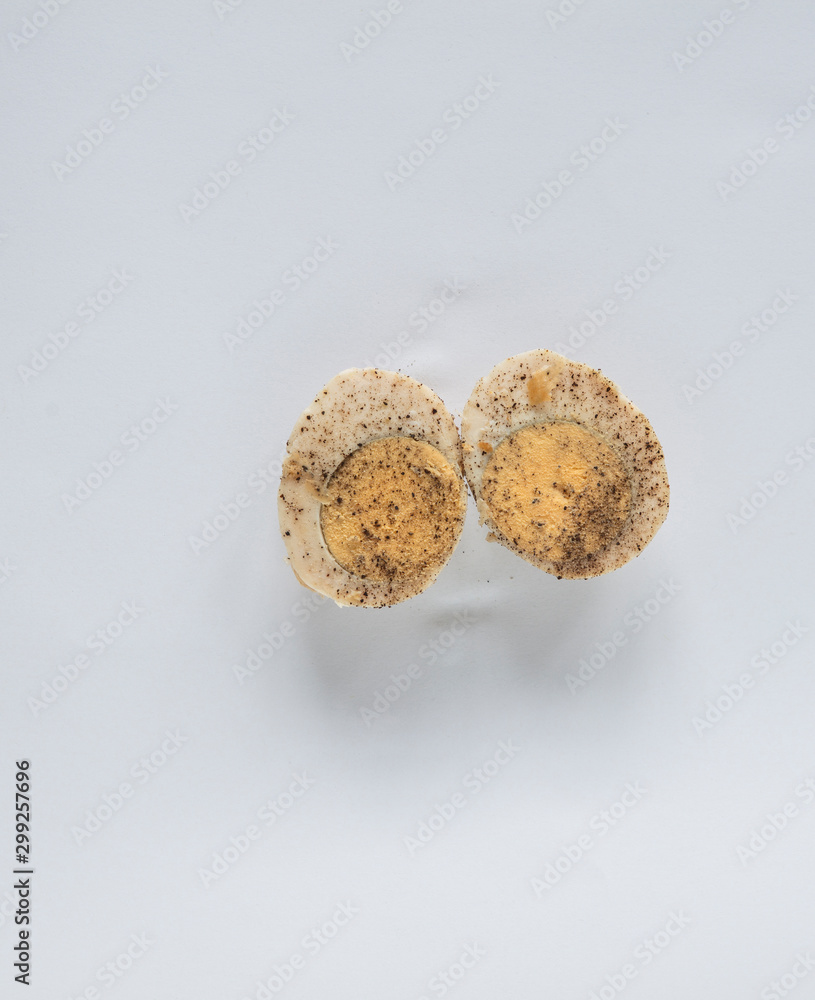 cooked egg split in half cooked egg split in half