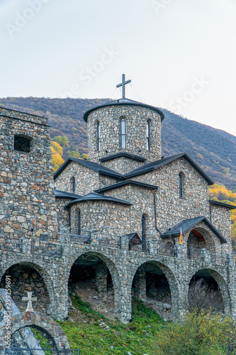 Russia, North Ossetia. Monastery in Fiagdon in the mountains in autumn photo