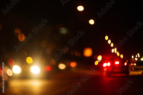 blur bokeh of car on the road. blur traffic at night.