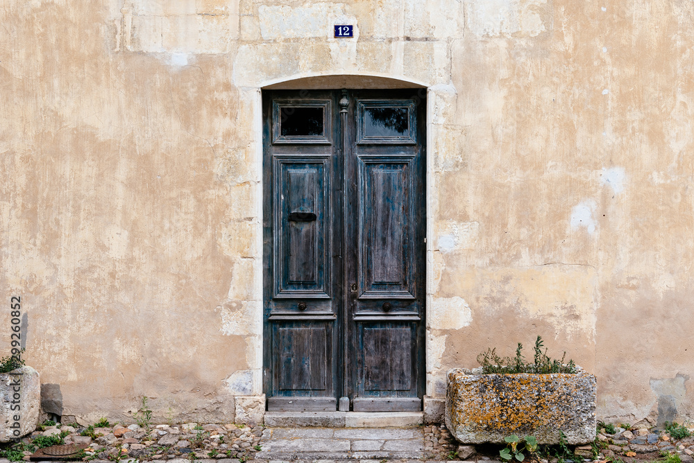 Old wooden closed door with number 12 Old wooden closed door with number 12