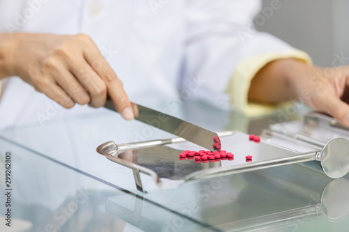 young asian women pharmacist checking drugs and packages medicine