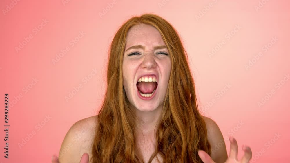 shouting shirtless girl in peach background shouting shirtless girl in peach background