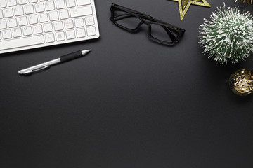 Merry Christmas and Happy new years office work space desktop concept. Flat lay top view with keyboard and Christmas ornaments with copy space.
