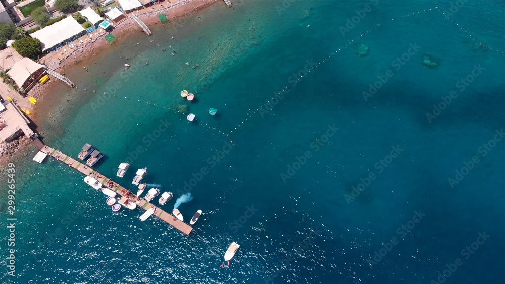 Aerial Image over Deck Marina With Speed boats and blue sea