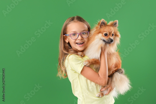 Cute little girl with dog o...