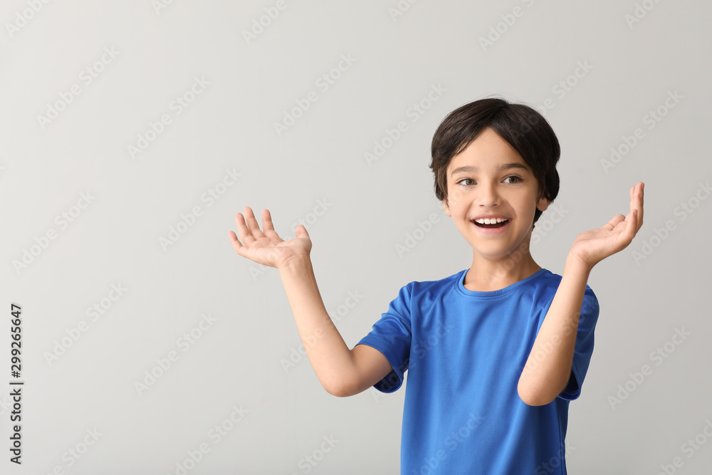 Happy little boy on light background Happy little boy on light background