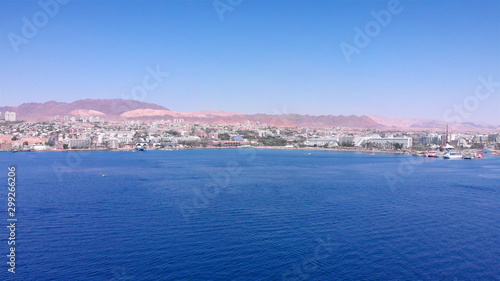Eilat City Skyilne with Hotels boats and desert aerial © ImageBank4U