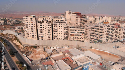 East Jerusalem Palestinian Refugge camp Surrounded By security Concerete Wall Drone Footage of Palestinian Refugge camp Shuafat With Security fence and Army Watch Tower photo