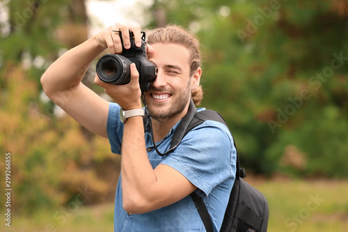 Young male photographer wit...
