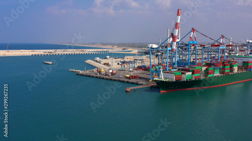 Drone view over Ashdod port with large tanker boat in Mediterranean sea, Israel