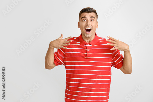 Surprised young man on ligh...