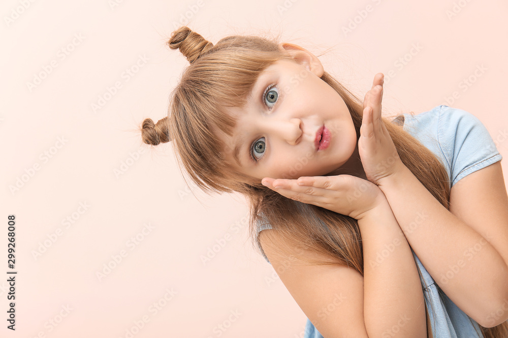 Obraz premium Cute little girl on color background
