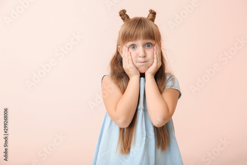 Surprised little girl on co...