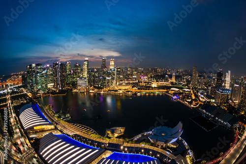 Aerial view of Singapore skyline and Marina Bay at sunset