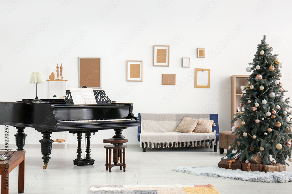 Fototapeta Grand piano with Christmas tree in interior of room