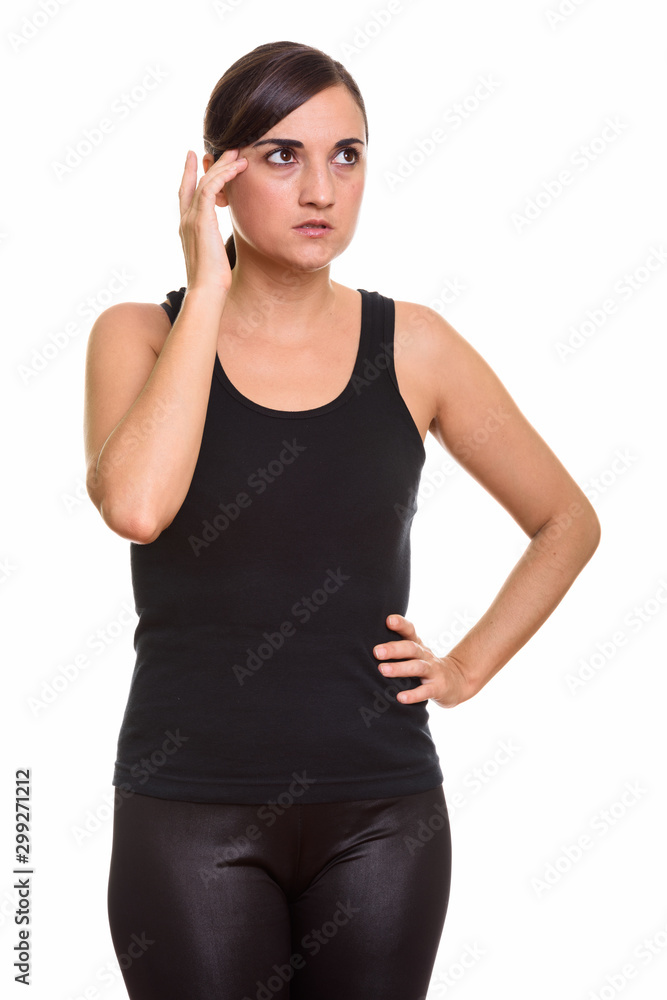 Studio shot of beautiful woman looking stressed Studio shot of beautiful woman looking stressed