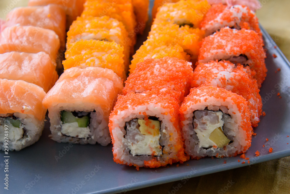 Sushi set on grey plate.