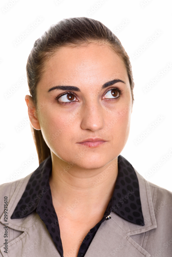 Face of young beautiful businesswoman with hair tied thinking Face of young beautiful businesswoman with hair tied thinking