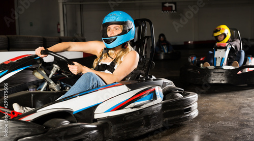 Female driving go-kart car indoor © JackF