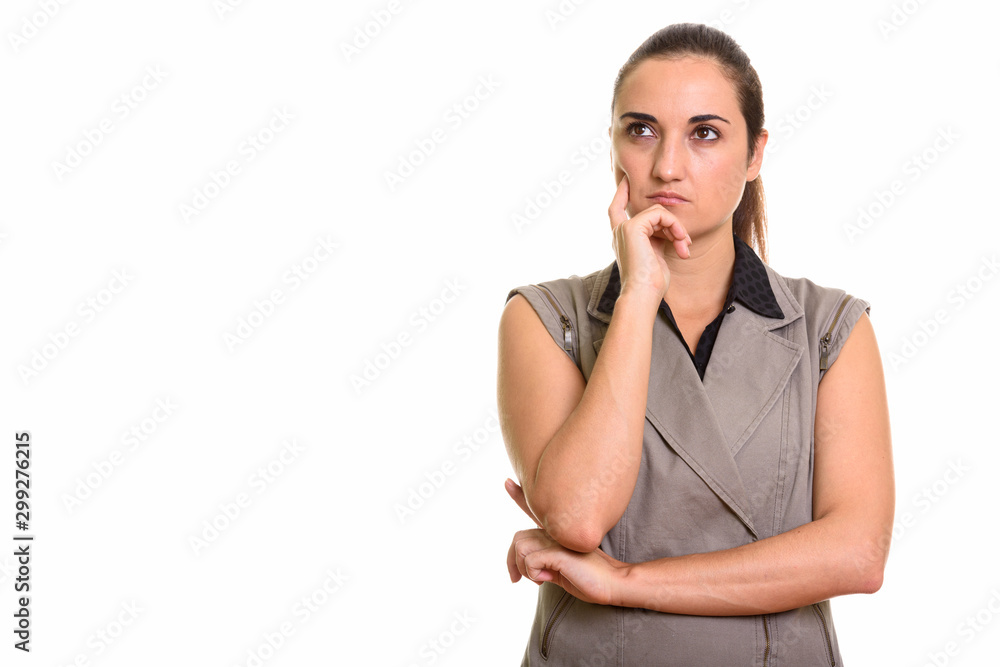 Portrait of young beautiful businesswoman with hair tied thinking Portrait of young beautiful businesswoman with hair tied thinking
