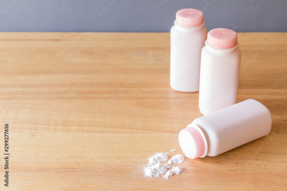 Talcum powder on wood background Talcum powder on wood background